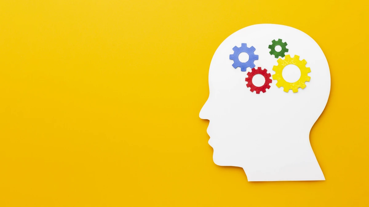 Desenho de uma cabeça humana e desenhos de engrenagem no lugar do cérebro.